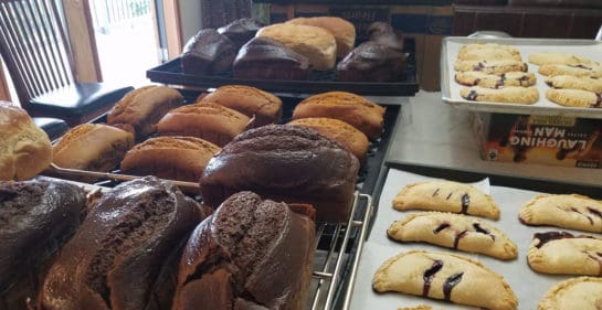 Trays of fresh pumpernickel bread and delicious turnovers
