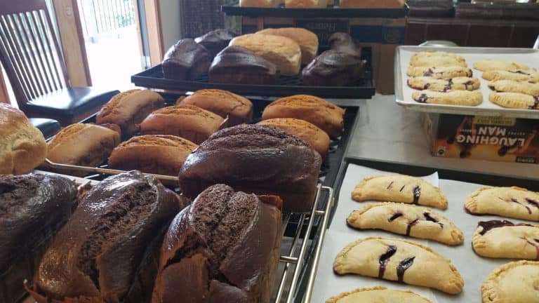 Trays of fresh pumpernickel bread and delicious turnovers