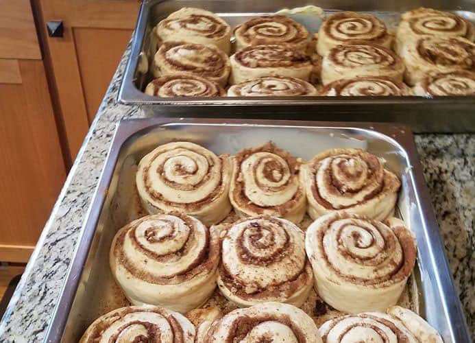 Tray full of cinnamon rolls